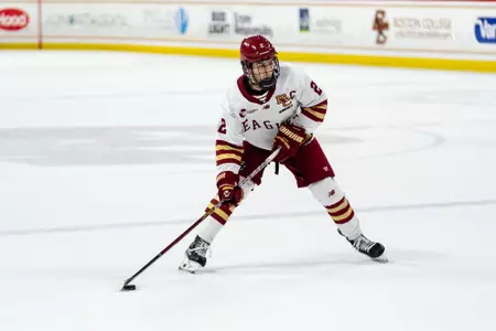 Eamon Powell skating with puck