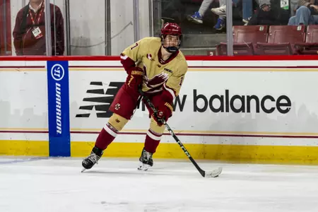 Aidan Hreschuk skating with puck against Maine