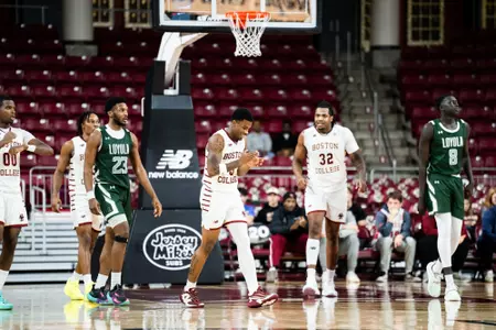 Fred Payne celebrates with the team vs. Loyola Maryland