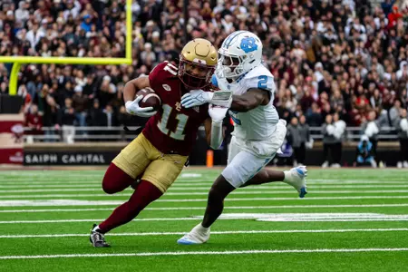 Lewis Bond attempts to break a tackle after a catch against UNC.