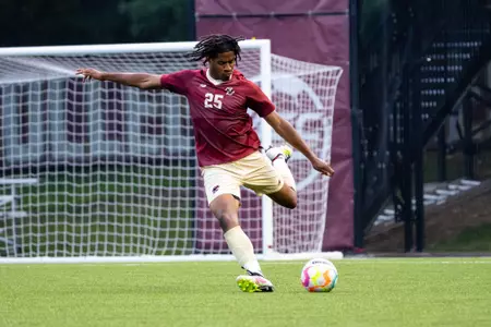 CJ Williams looking to play a long pass against Providence