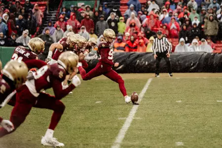 Liam Connor kicks off at the 2023 Fenway Bowl.