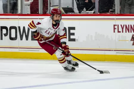 Teddy Stiga skating with the puck against UConn