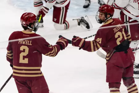 Eamon Powell and Oskar Jellvik bump fists following Jellvik's goal vs. Harvard at TD Garden.