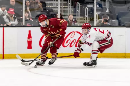 Ryan Leonard wins the puck vs. Harvard at TD Garden.