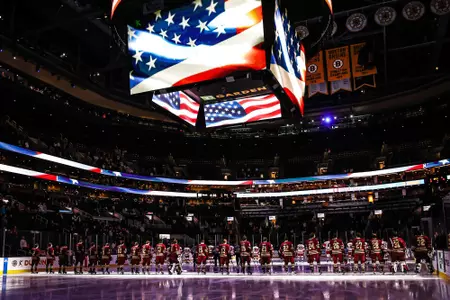 BC players line up on the blue line during the National Anthem at the 2023 Beanpot Consolation game at TD Garden.