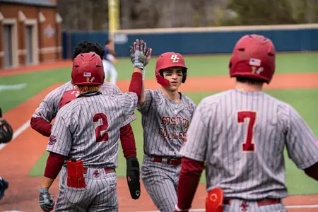 Cam Caraher and Adam Magpoc high five