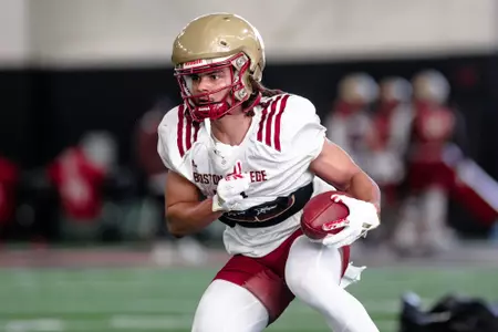 Lewis Bond makes a move after a catch.