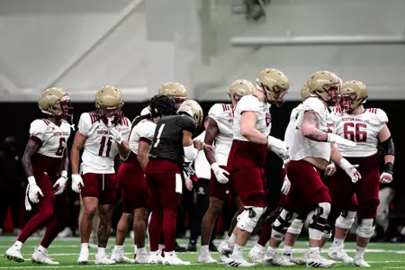 Thomas Castellanos and the offense break a huddle.