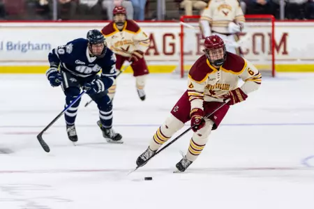Will Smith skates across center ice with the puck vs. New Hampshire.