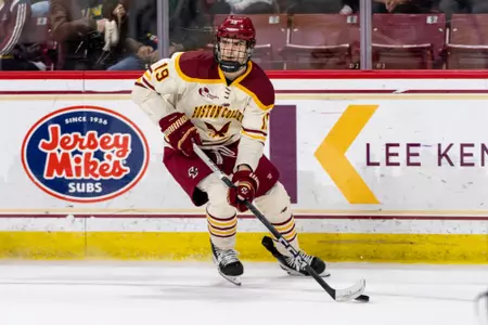 Cutter Gauthier holds the puck vs. New Hampshire.