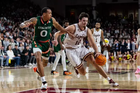Quinten Post drives to the basket in the Eagles' first matchup versus Miami