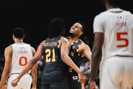 Claudell Harris Jr. and Devin McGlockton celebrate after BC's win at Miami