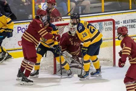 Jan Korec eyes the puck through traffic in front of the BC net at Merrimack.