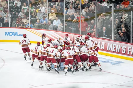 Team huddle vs. Denver.
