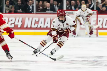 Will Smith skating near center ice vs. Denver.