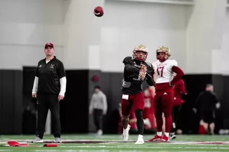 Bill O'Brien observes Thomas Castellanos throw in a spring practice inside Fish Field House.