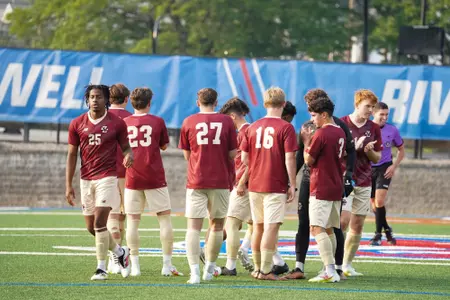 Men's Soccer team huddle at UMass Lowell