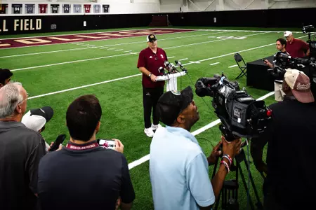 Bill O'Brien at the podium during BC football's local media day inside Fish Field House.