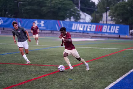 Xavier O'Neil dribbling at UMass Lowell