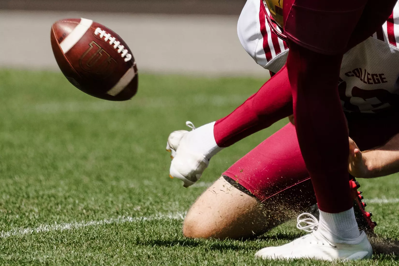 Football flying into the air after a kick