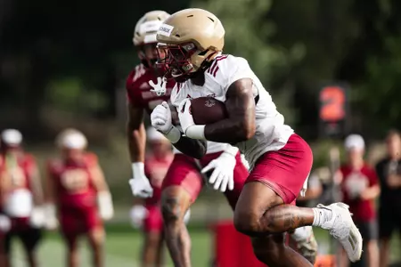Kye Robichaux runs with the ball in practice number one.