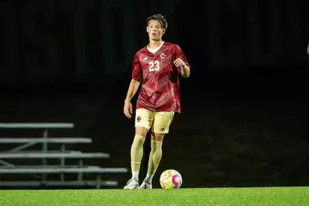 Jack Burkhardt with ball against Syracuse