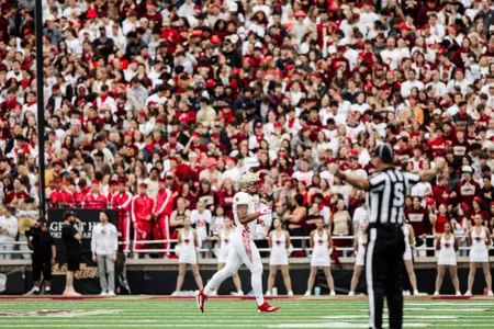 Jeremiah Franklin in Red Bandanna Uniform with full fan section in the background.