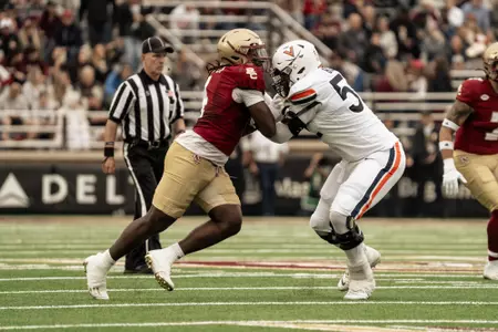 Neto Okpala rushes off the edge against Virginia.