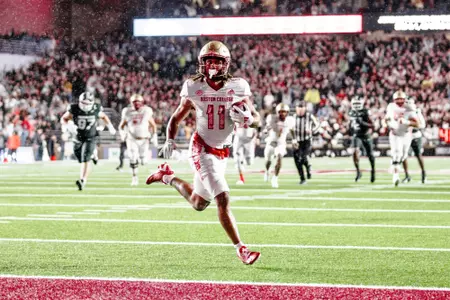 Lewis Bond races toward the end zone against Michigan State.