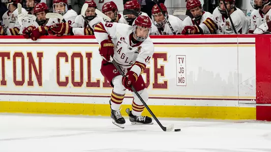 Brady Berard skating with puck against Merrimack