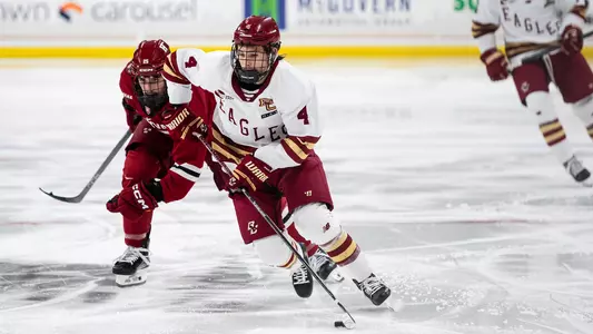 Teddy Stiga skating with the puck against Harvard