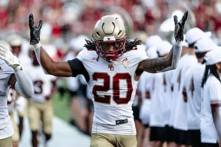 K.P. Price runs out to the field pregame at Florida State.