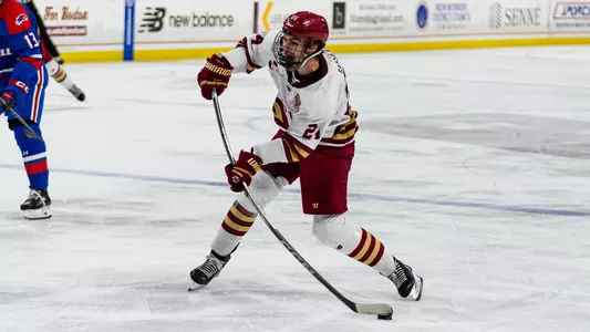 Andre Gasseau shooting the puck against UMass Lowell