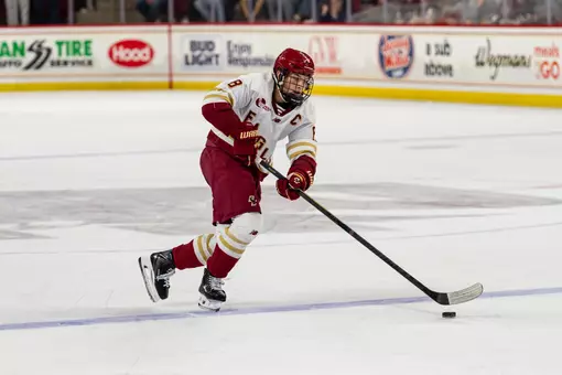 Lukas Gustafsson skating with the puck against Quinnipiac