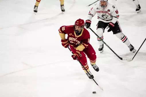 James Hagens skating with puck against Northeastern