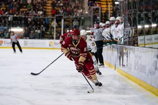 Jake Sondreal skating with the puck against Vermont
