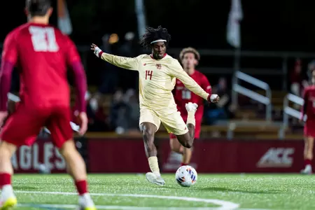 Michael Asare shooting the ball against Saint Joseph's