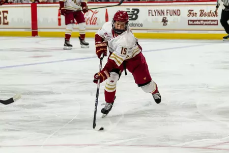 Oskar Jellvik skating with the puck against Northeastern