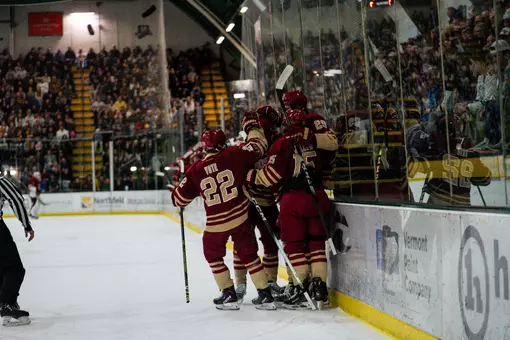 Men's Hockey celebrates goal against Vermont