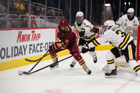 Jake Sondreal holding off two WMU skaters