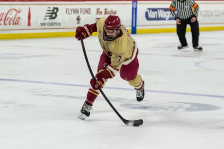 Will Skahan shooting the puck against Notre Dame