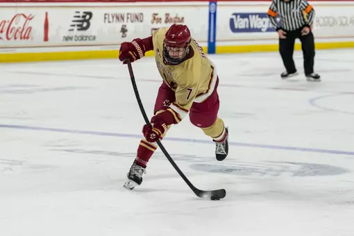 Will Skahan shooting the puck against Notre Dame
