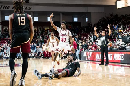 Chas Kelley celebrates a game-winning three against Florida State