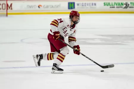 Gabe Perreault skating with puck against UMass