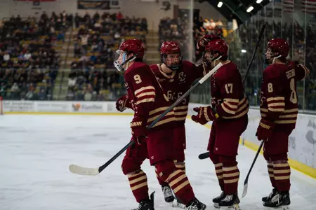 Men's Hockey celebrating Leonard goal against UVM