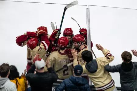 BC players mob Eamon Powell after a goal vs. Northeastern at TD Garden in the Beanpot Semifinals.