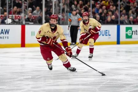 Teddy Stiga skates with the puck vs. Northeastern at TD Garden in the Beanpot Semifinals.