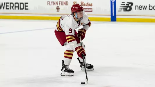 Ryan Leonard skating with the puck