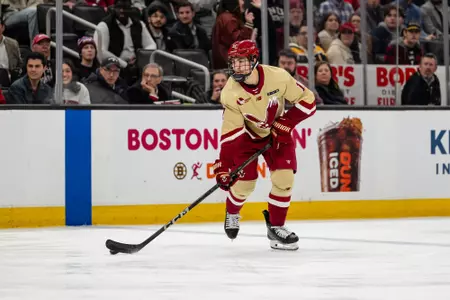 Aram Minnetian skating with the puck during the Beanpot